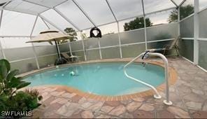 4556 Varsity Cir, Lehigh Acres, FL 33971 - view of swimming pool with a patio area and a lanai