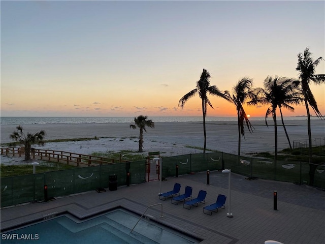 6620 Estero Blvd Unit 205, Fort Myers Beach, FL 33931 - pool at dusk featuring a water view