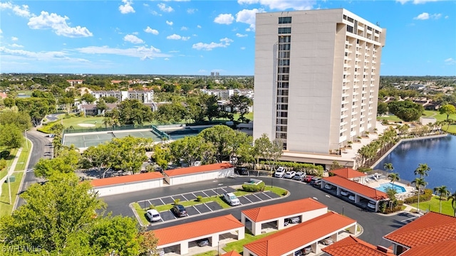 birds eye view of property with a water view