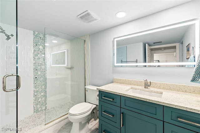 bathroom with visible vents, a shower stall, toilet, and vanity