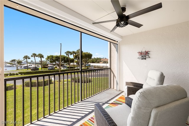 sunroom / solarium with ceiling fan