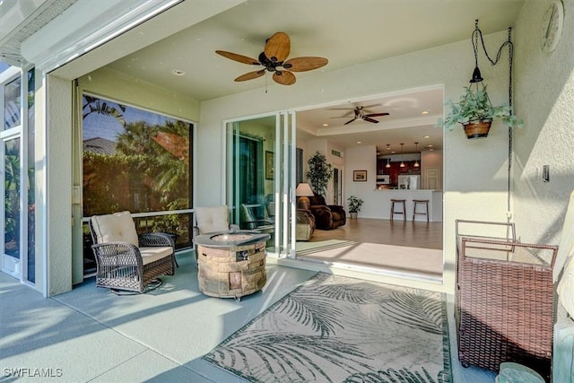 view of patio featuring a ceiling fan