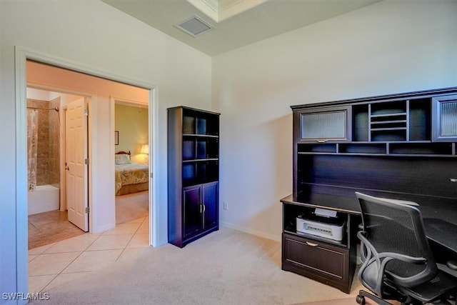 office area featuring visible vents, light carpet, baseboards, and light tile patterned flooring