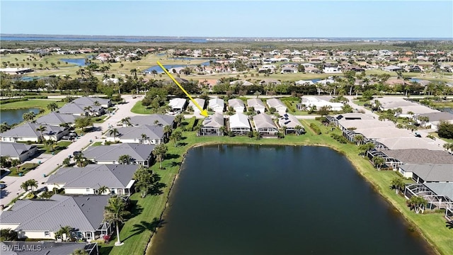 bird's eye view with a residential view and a water view