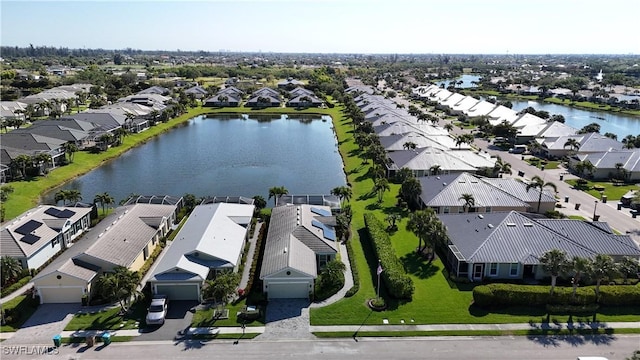 bird's eye view featuring a residential view and a water view