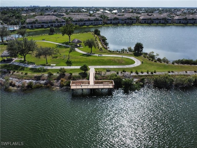 drone / aerial view with a residential view and a water view