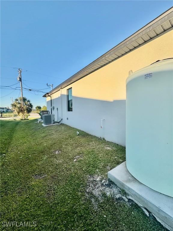 view of yard with central AC unit