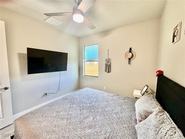 bedroom featuring baseboards and a ceiling fan