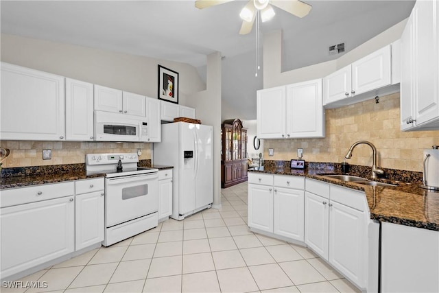 kitchen featuring a sink, visible vents, white appliances, and white cabinetry