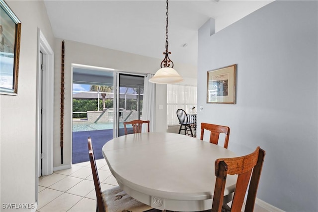 dining area with light tile patterned floors and baseboards