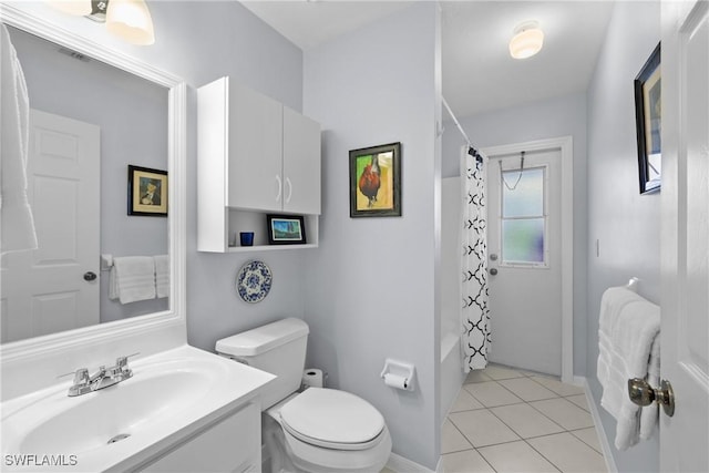 full bath featuring toilet, shower / bath combo, tile patterned flooring, baseboards, and vanity