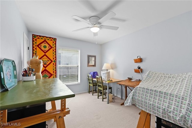 carpeted bedroom featuring baseboards and ceiling fan