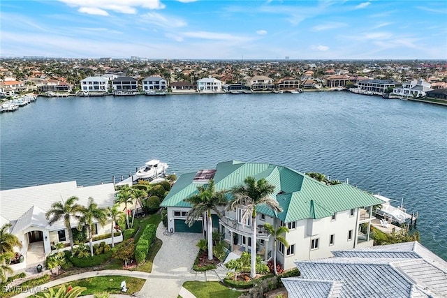 bird's eye view featuring a residential view and a water view