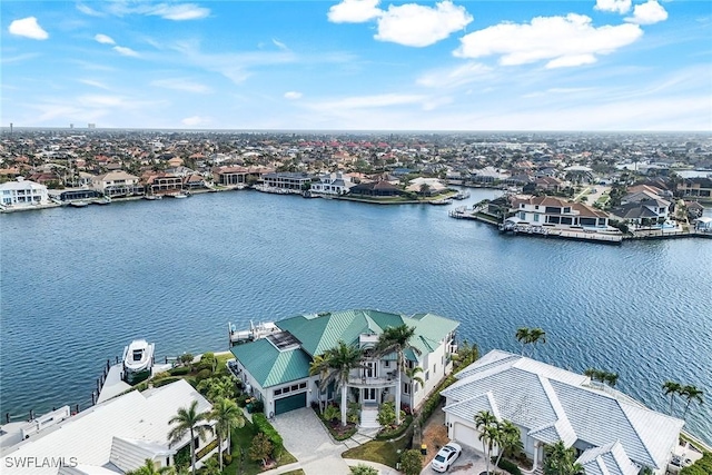 birds eye view of property with a residential view and a water view