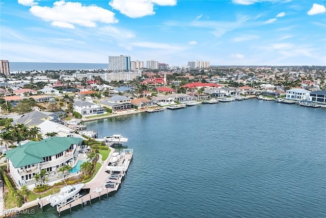 aerial view featuring a view of city and a water view