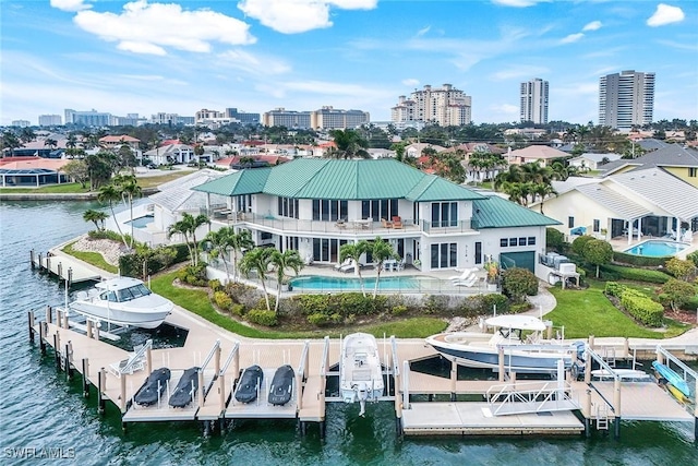 drone / aerial view with a water view and a city view