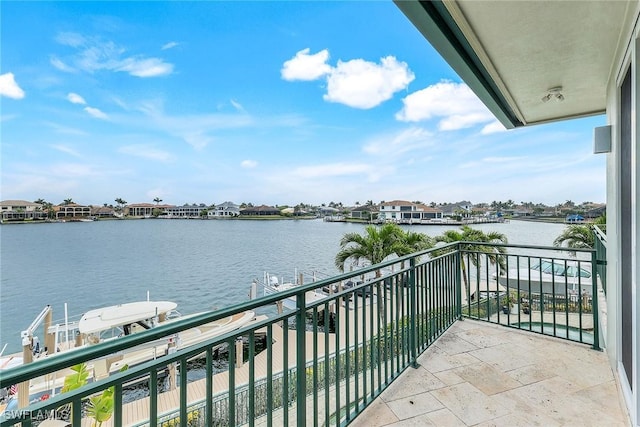 balcony featuring a water view