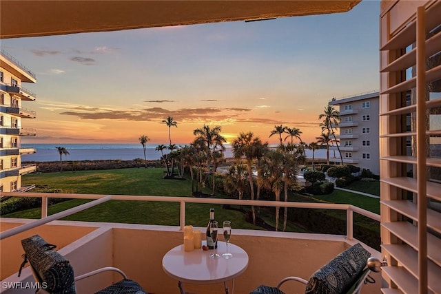 220 Seaview Ct Unit 305, Marco Island, FL 34145 - balcony at dusk with a water view