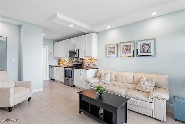 220 Seaview Ct Unit 305, Marco Island, FL 34145 - living area featuring baseboards and recessed lighting