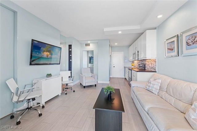 220 Seaview Ct Unit 305, Marco Island, FL 34145 - living area featuring visible vents, baseboards, and recessed lighting