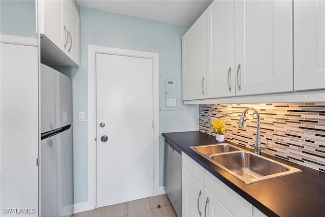 220 Seaview Ct Unit 305, Marco Island, FL 34145 - kitchen featuring stainless steel appliances, a sink, dark countertops, and tasteful backsplash