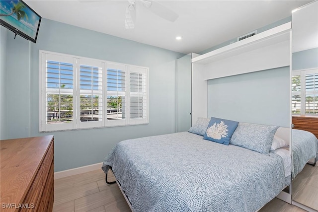 220 Seaview Ct Unit 305, Marco Island, FL 34145 - bedroom with wood finished floors, baseboards, visible vents, ceiling fan, and recessed lighting