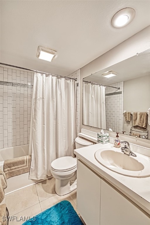 full bathroom with vanity, tile patterned floors, shower / tub combo, and toilet