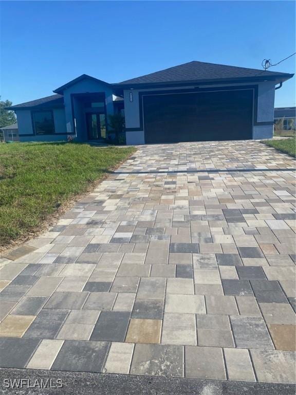 4108 35th St SW, Lehigh Acres, FL 33976 - view of front of property with decorative driveway and a garage
