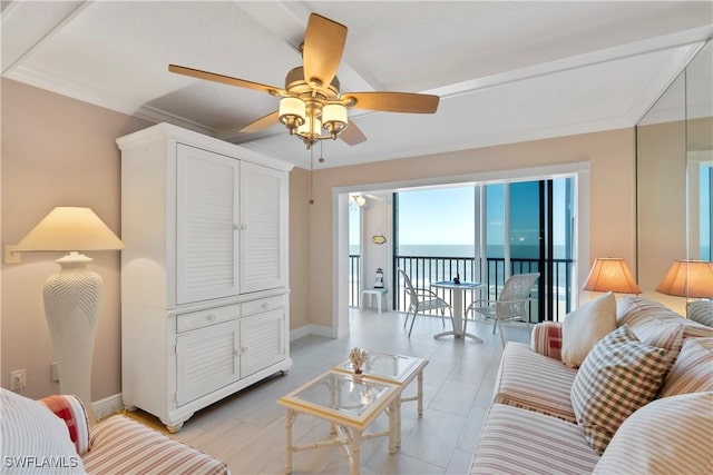25900 Hickory Blvd Unit 405, Bonita Springs, FL 34134 - living area featuring a ceiling fan, baseboards, and a water view