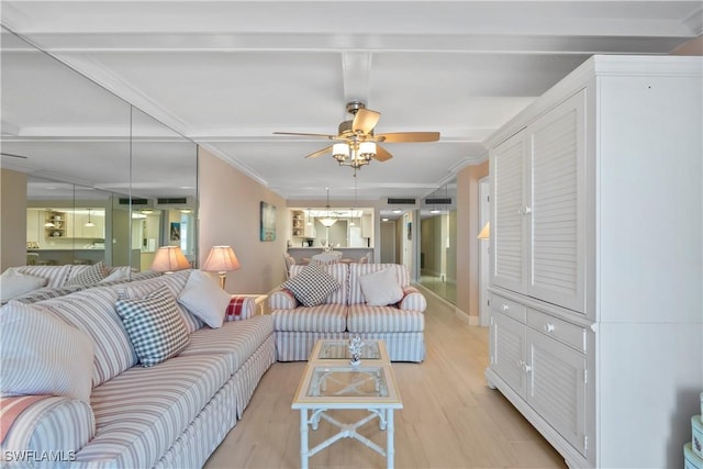 25900 Hickory Blvd Unit 405, Bonita Springs, FL 34134 - living room featuring light wood finished floors, a ceiling fan, and ornamental molding