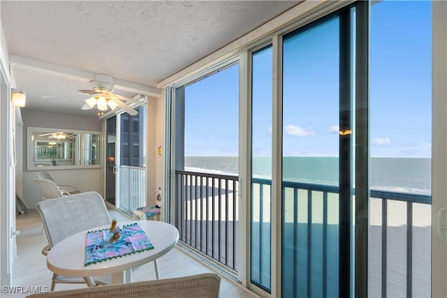 25900 Hickory Blvd Unit 405, Bonita Springs, FL 34134 - sunroom featuring view of water and beach and ceiling fan