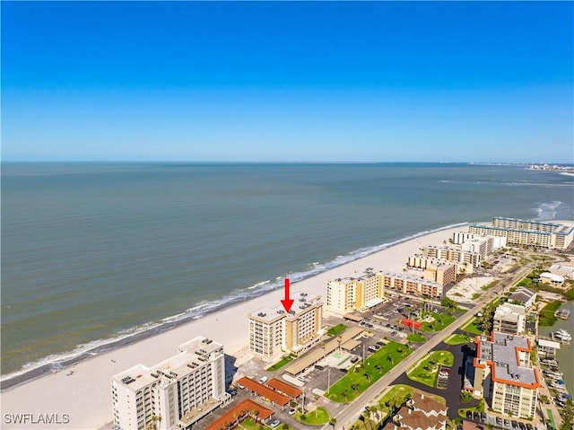 aerial view featuring a beach view, a view of city, and a water view