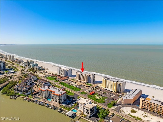 birds eye view of property with a view of city and a water view