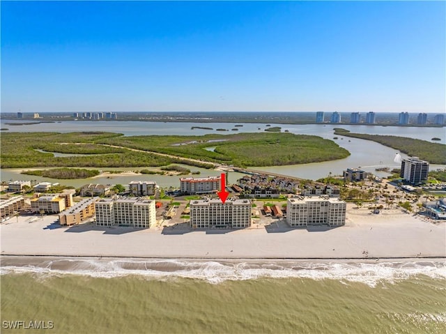 birds eye view of property featuring a city view and a water view