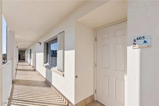 entrance to property with stucco siding