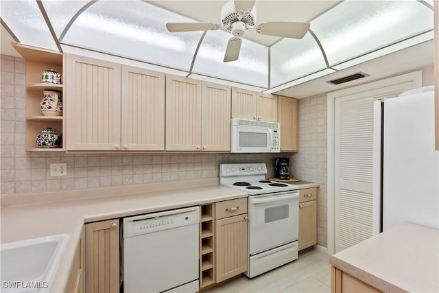 25900 Hickory Blvd Unit 405, Bonita Springs, FL 34134 - kitchen featuring white appliances, open shelves, a sink, and light countertops