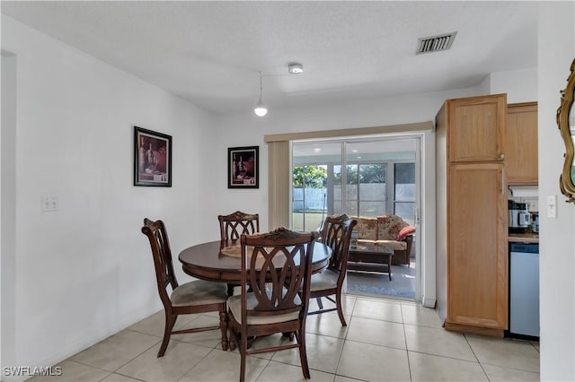 dining area with visible vents and light tile patterned flooring