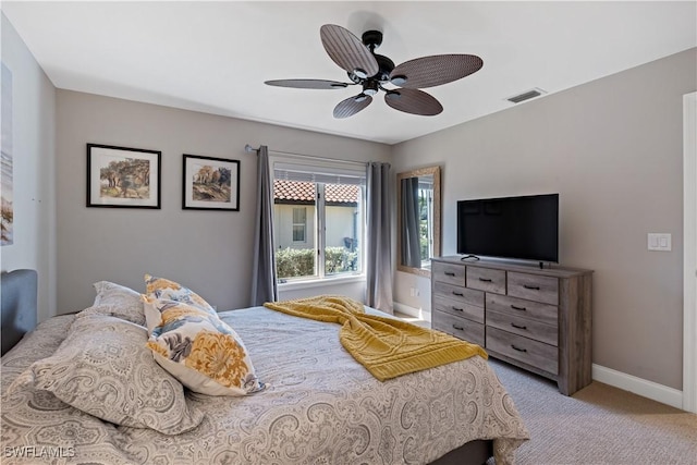 bedroom featuring visible vents, carpet flooring, a ceiling fan, and baseboards