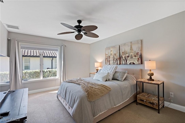 carpeted bedroom with baseboards, visible vents, and ceiling fan