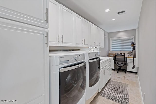 washroom featuring washer and dryer, visible vents, cabinet space, and recessed lighting