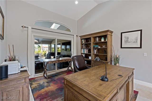 office with baseboards and vaulted ceiling