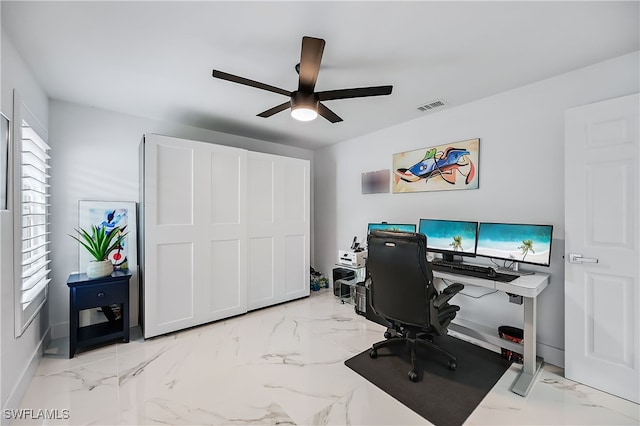 office area featuring visible vents, marble finish floor, and ceiling fan