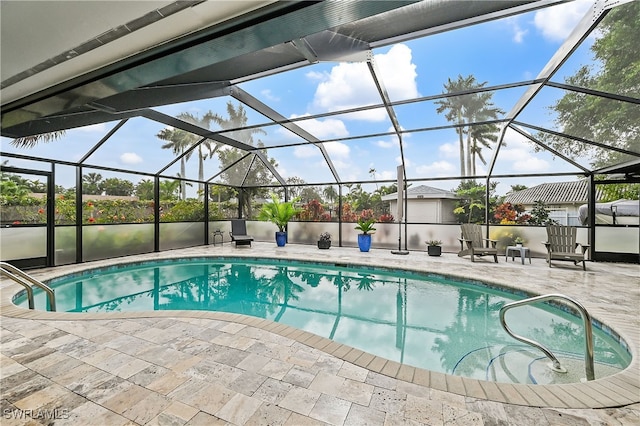 outdoor pool with a patio area