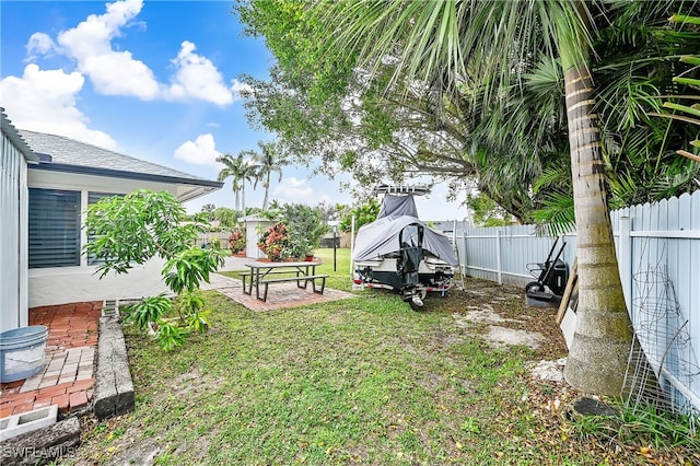 view of yard featuring a patio and a fenced backyard