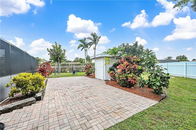 view of patio / terrace featuring an outdoor structure and a fenced backyard