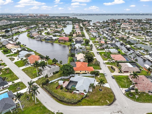 bird's eye view with a residential view and a water view