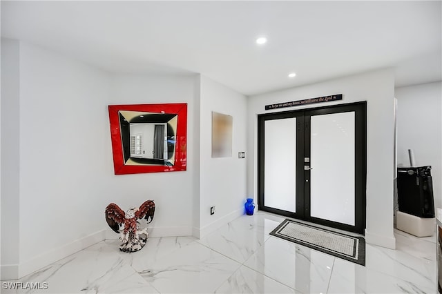 entrance foyer with recessed lighting, baseboards, and marble finish floor