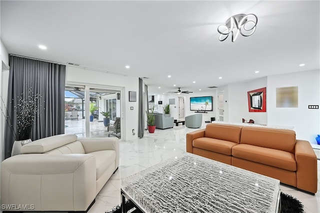 living area with recessed lighting, visible vents, marble finish floor, and a ceiling fan