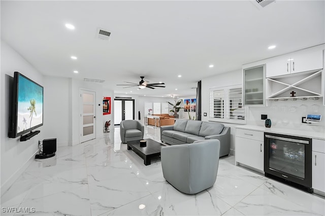 living room featuring wine cooler, recessed lighting, marble finish floor, and a ceiling fan