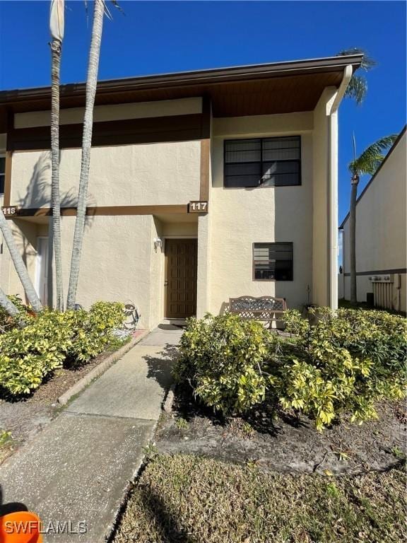 entrance to property with stucco siding